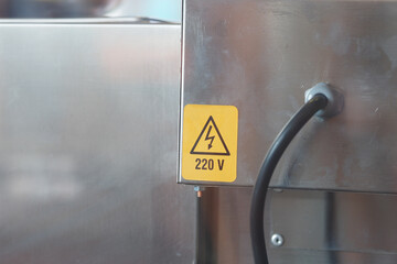 Voltage warning label for electrical equipment