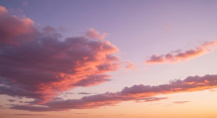 Obraz premium Sunset sky with pink and purple clouds, soft orange horizon