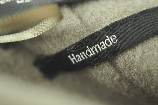 Handmade label on soft textile in cozy setting