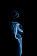 Obraz premium Blue hot curly steam smoke isolated on black background. Abstract background, design element, for overlay on pictures. Create mystical Halloween photos, for overlay on pictures