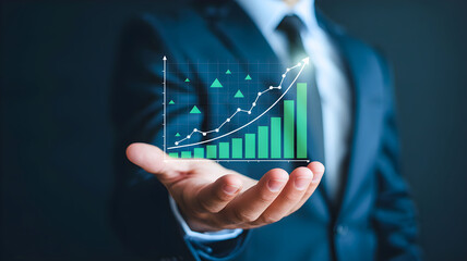 Businessman's hand holding a growing green financial chart showing upward trend