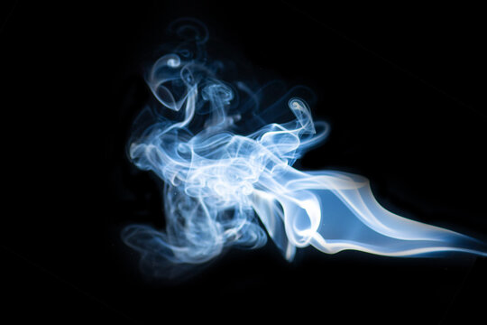 Blue hot horizontal curly steam smoke isolated on black background. Abstract background, design element, for overlay on pictures. Create mystical Halloween photos, for overlay on pictures - Powered by Adobe