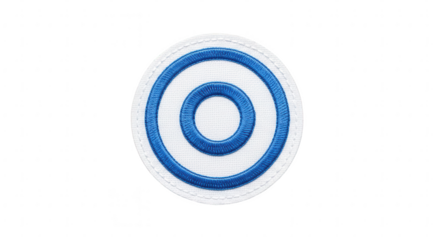 Embroidered circular patch with blue concentric rings on white fabric, isolated studio shot