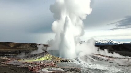Erupting geyser expels steam and water amidst colorful mineral deposits - Powered by Adobe
