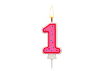 Pink polka dot number one birthday candle with a lit flame