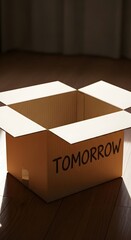 Open cardboard box with the word 'TOMORROW' written on it, placed on a wooden floor with a dark background and curtains behind, suggesting anticipation or future plans