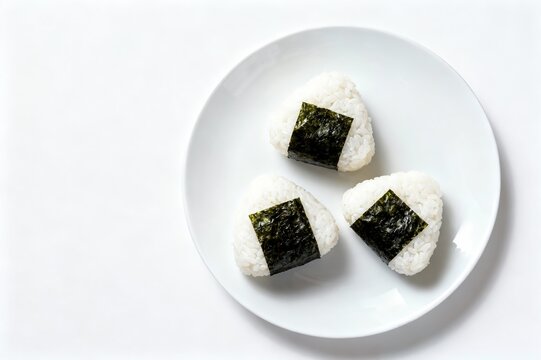 Japanese onigir on plate on a white isolated background.