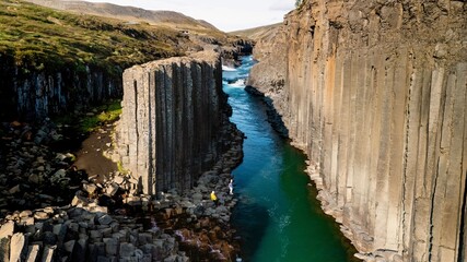 Exploring the breathtaking formations of Studlagil Canyon in Icelands stunning landscape