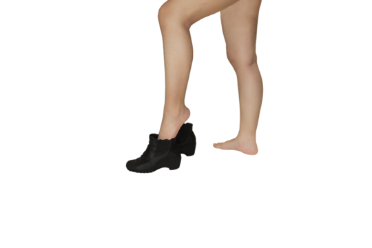 Close up of a woman's leg lifted up to put on women's ankle boots isolated on transparent background png file.
