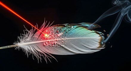 A close-up image of a colorful feather with a red laser beam and smoke against a dark background, highlighting intricate details and vibrant hues