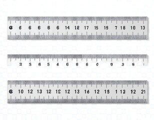 Close-up shot featuring three rulers with clearly visible measurements, laid out on a white backdrop