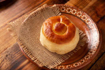 Bisquet. Also known as Bisquets Chinos, it is one of the traditional breads in Mexico, commonly consumed hot, cut in half and spread with butter and fruit jam.