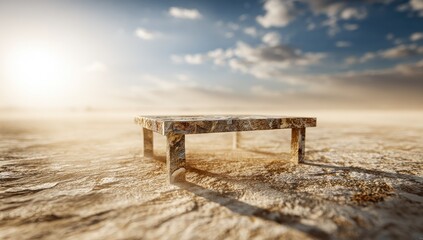 Lonely table sits upon a dry, cracked plain under a sunny sky