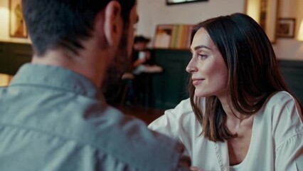 Couple meet accidentally years later in a café, hesitant smiles, unresolved emotions.
