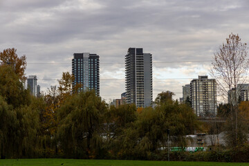 Obraz premium City Skyline With Modern High-Rise Buildings Over a Park in New Westminster, Vancouver Area