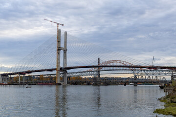 Fototapeta premium Under Construction Cable-Stayed Bridge In New Westminster Over Fraser River, Vancouver Area
