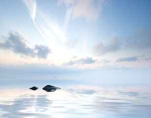 Serene scene featuring calm water, stones, and a soft, cloudy sky
