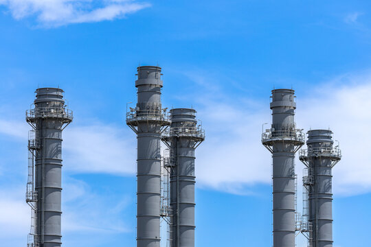 oil refinery petrochemical plant oil gas and energy production with flare stack smoke pollution emission, chemical and polymer production engineering technology for climate change control efficiency