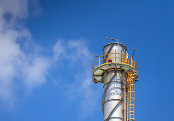 oil refinery petrochemical plant oil gas and energy production with flare stack smoke pollution emission, chemical and polymer production engineering technology for climate change control efficiency