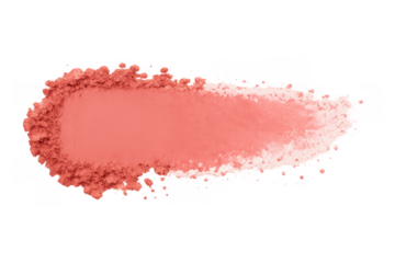 Coral blush powder swatch with scattered texture
