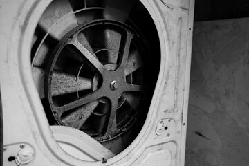 A close up of a fan with a black and white filter