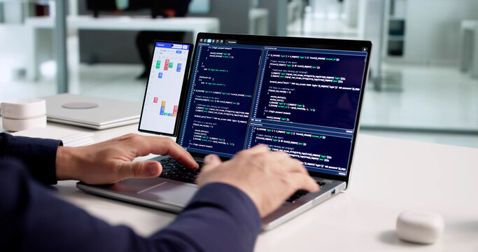 Professional Programmer Organizing Schedule And Developing Software - Powered by Adobe