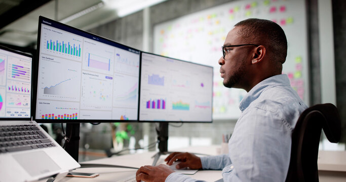 Focused African American Man Analyzing KPI Data