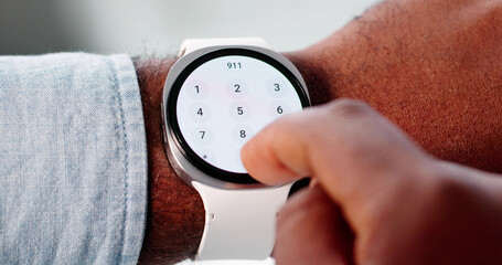 African American Man Dialing 911 On Smartwatch