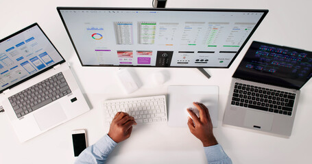 Skilled African American Man Designing UI On Computer