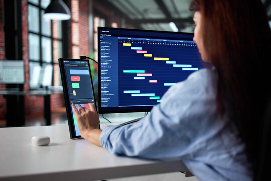 Woman In Business Attire Analyzing Data