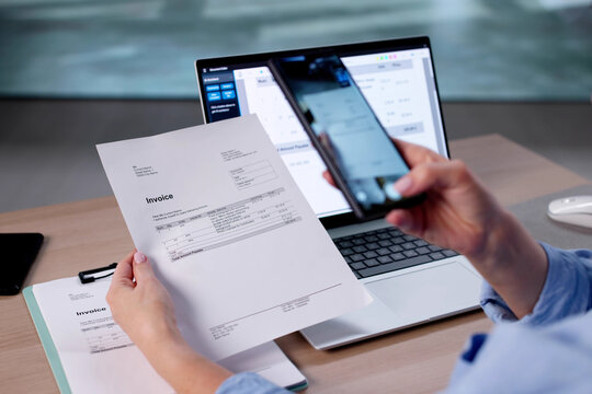 Businesswoman Using Smartphone To Capture Documents