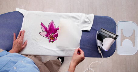 Woman Customizing T-shirt Design With Iron Transfer Press