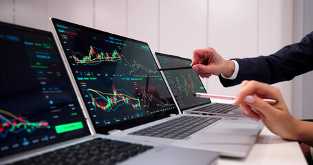 Financial Analysts Studying Market Trends