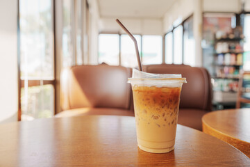 Iced coffee on wooden table.