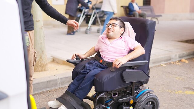 Man entering wheelchair accessible van for transportation