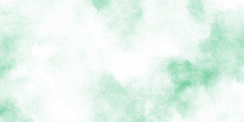 Abstract mint green watercolor texture background with soft cloudy and turquoise tones blended into cloudy, diffused splashes.	