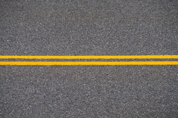 Fototapeta premium double yellow line on the road surface