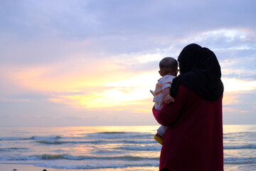 Mother and Child at Twilight Beach