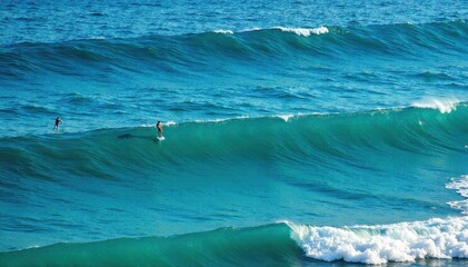 Ocean Waves Highlighted by Sunlight Ocean waves with a dramatic highlighter effect, emphasizing the texture and movement of the water. No people or boats.