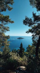 Scenic coastal view through trees, island in the distance under a clear blue sky