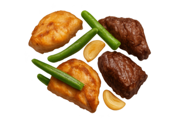Two golden puff pastries paired with roasted meat chunks, green beans, and garlic cloves
