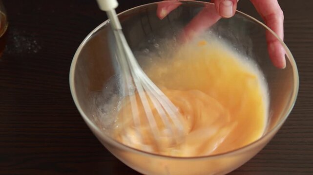 mixing ingredients for pumpkin bread loaf