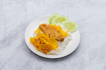 Thai food stir fried with spicy curry paste With different kinds of meat topped on cooked rice