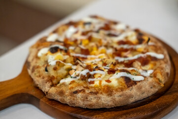 Close up of Pizza on the wooden pan
