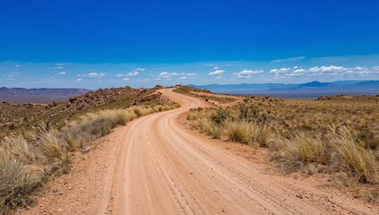 Fototapeta premium Deserted Road, Clear Sky, and Distant Mountains, A Journey into the Unknown.