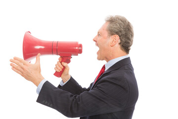 Mature Businessman shouting in red megaphone