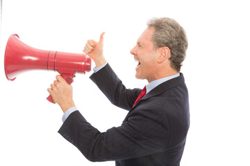 Mature Businessman shouting in red megaphone