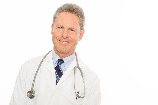 Mature caucasian doctor portrait, smiling at camera