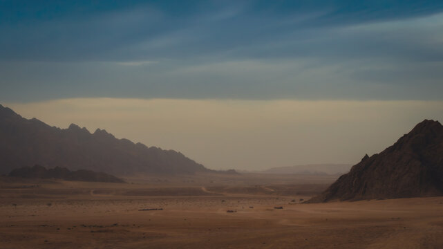 rocky mountains and desert landscape and sunset sky in Egypt