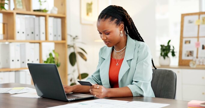 Office, laptop and woman with credit card, purchase and search for discount on website and ecommerce. Online shopping, employee and black person with tech for digital payment, transaction and sale - Powered by Adobe